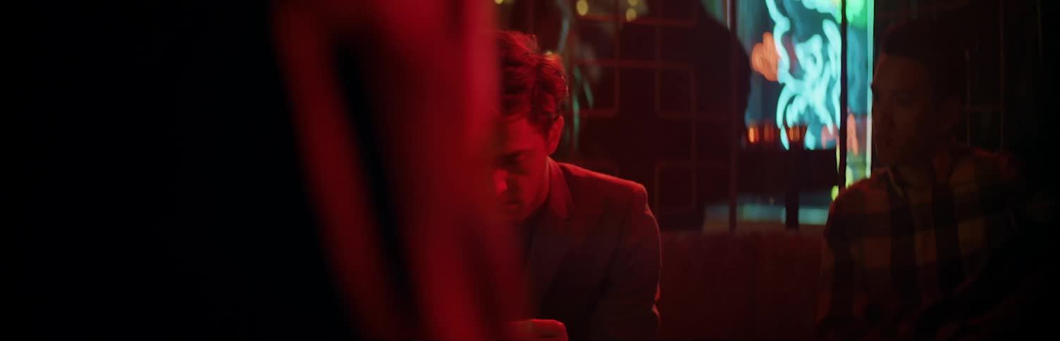 Man at club sitting on couch
