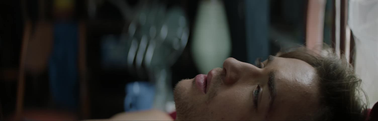 A man trembles while laying down