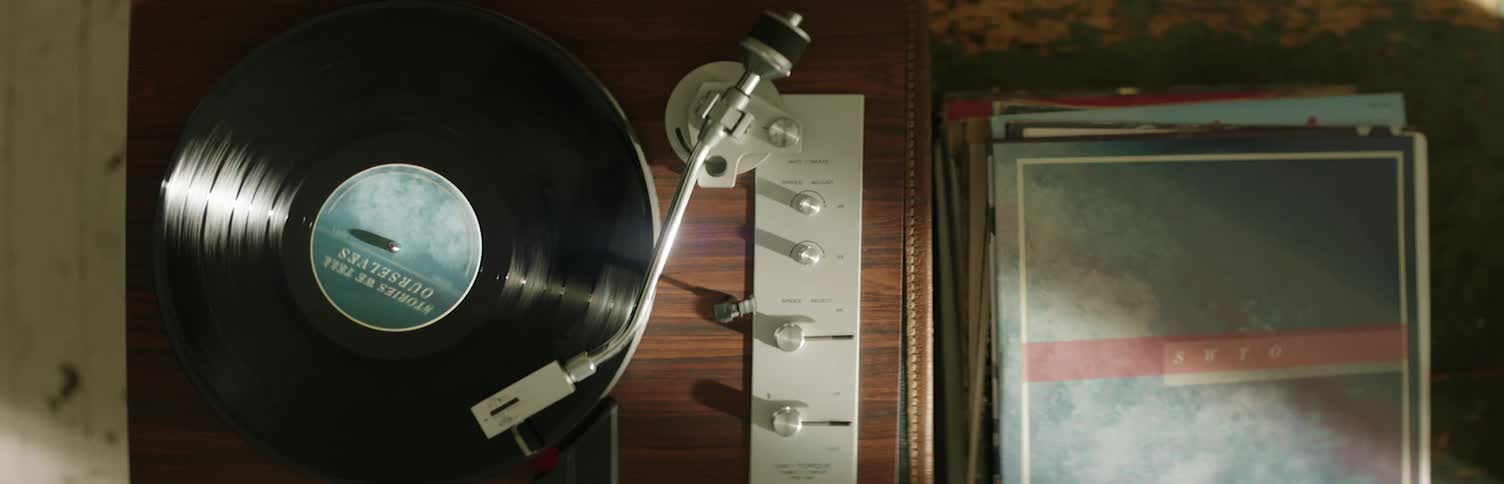 Record player on table spinning 