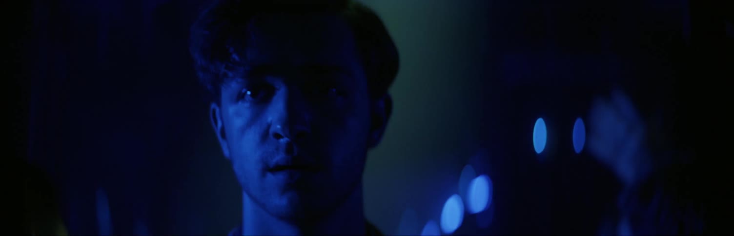 Man walking through club looking for someone