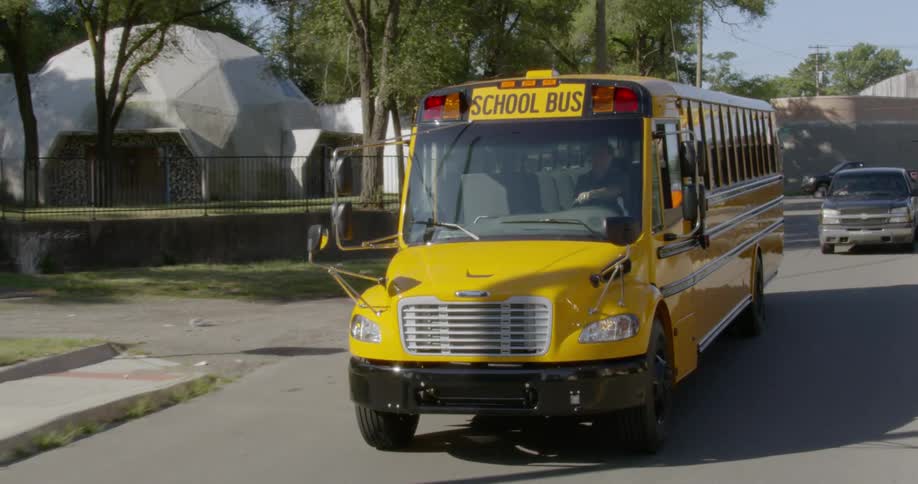 A bus is travelling down a busy road