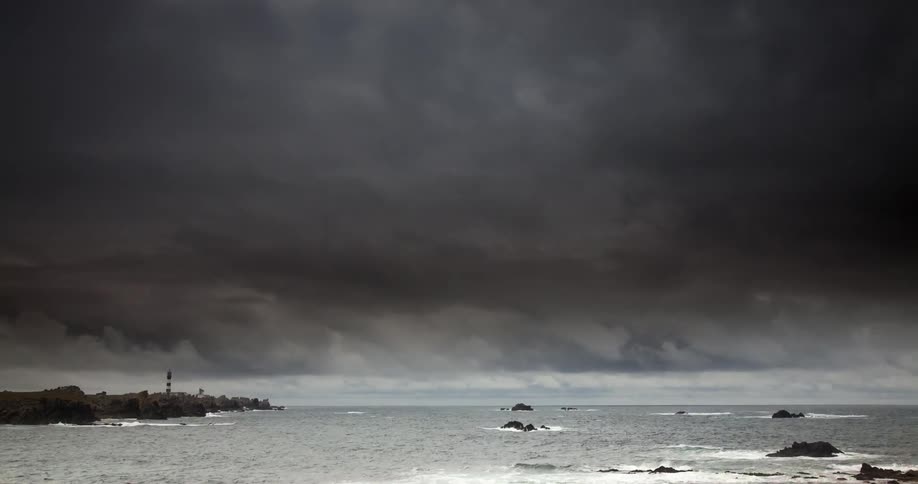 Storm clouds pass over the shoreline