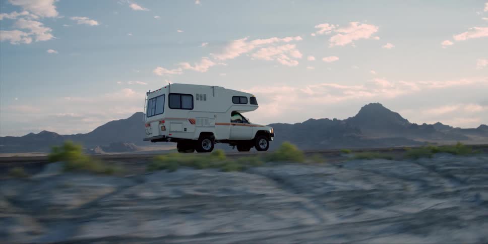 The recreational vehicle speeds down the road