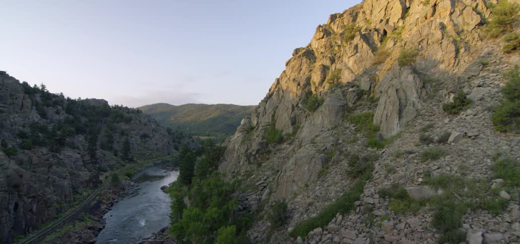 A river winds through rocky mountains