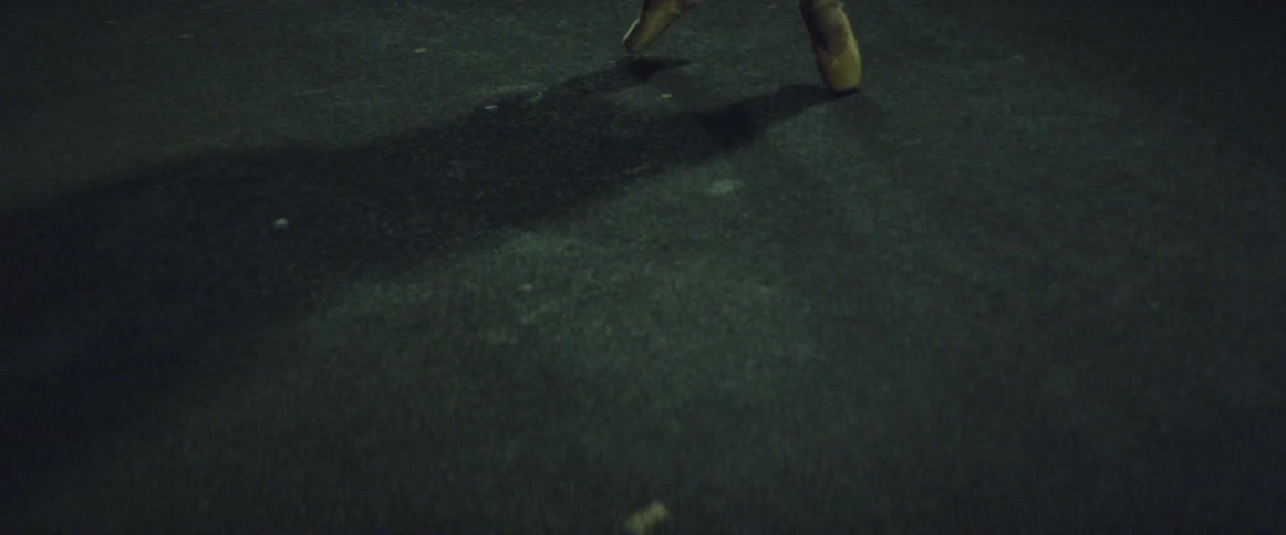 A ballerina balances and twirls