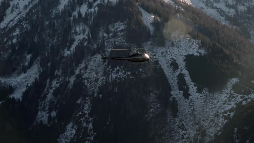 A helicopter near a mountain