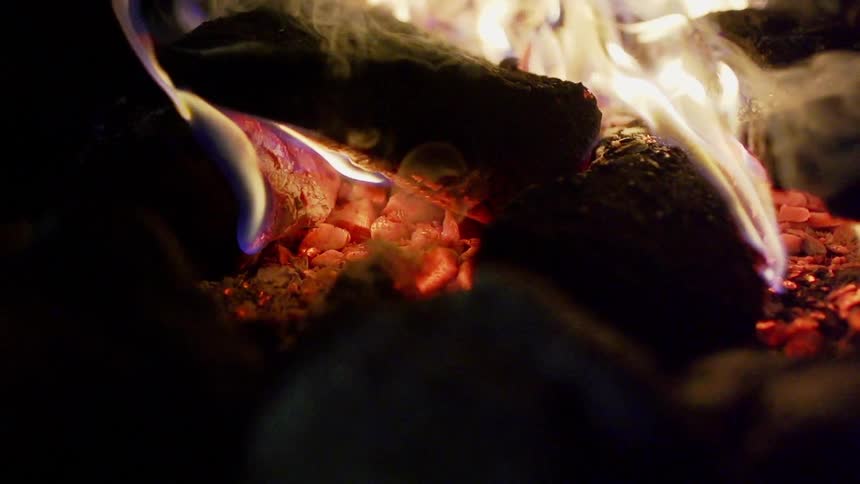 Smoke rises from a burning fire