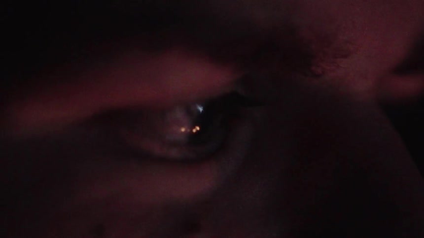 A person is looking at a flickering fire