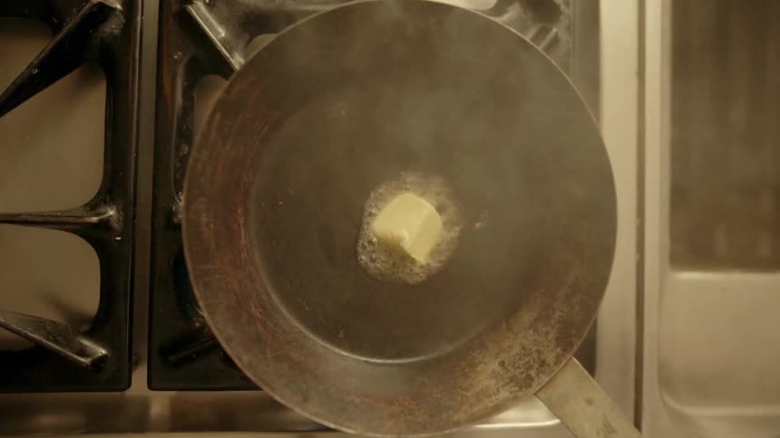 Butter is dropped into a hot pan