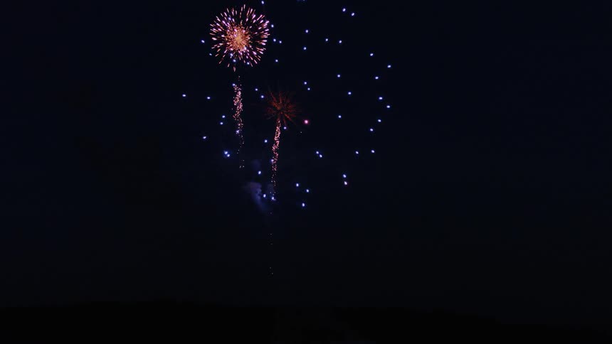 Fireworks explode in the sky