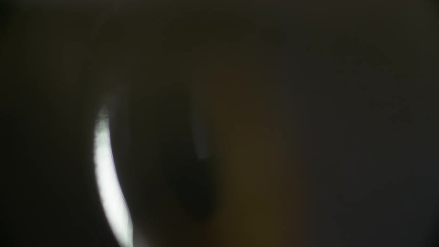 Eyeball with eyelid blinking over it