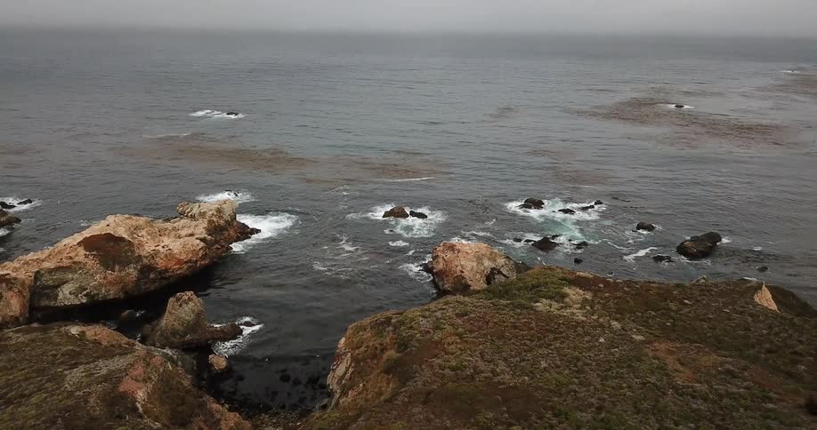 A rocky California shore during the day