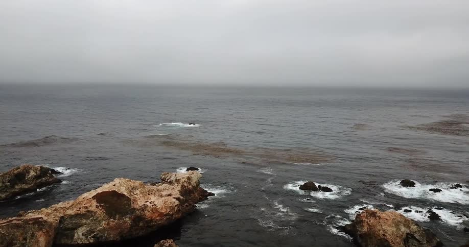 Waves flow onto the rocky shore