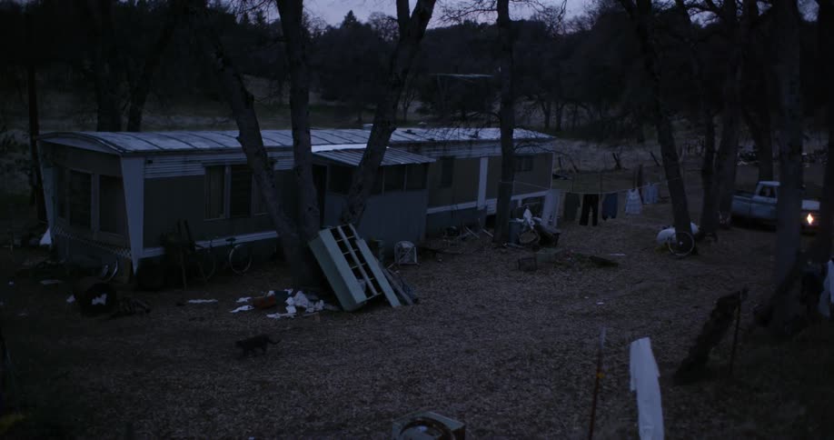 A truck pulls up to a trailer
