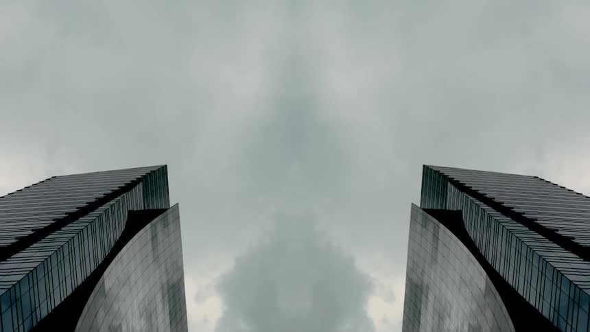 Two tall buildings are parallel to each other