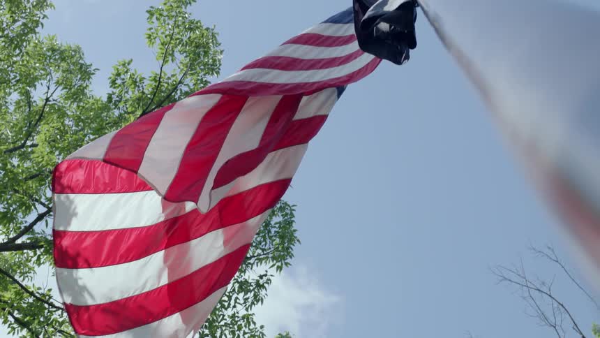 An american flag waves in the breeze