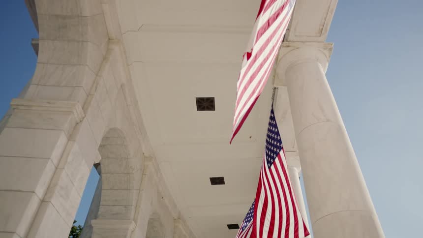 American flags hang from a building