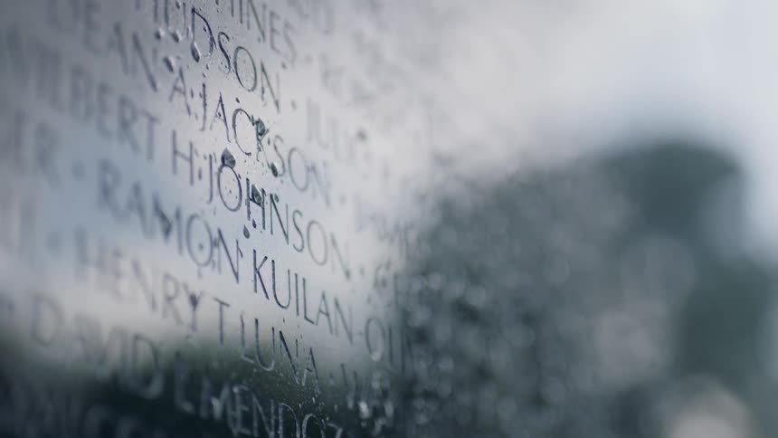 Names cover a memorial wall