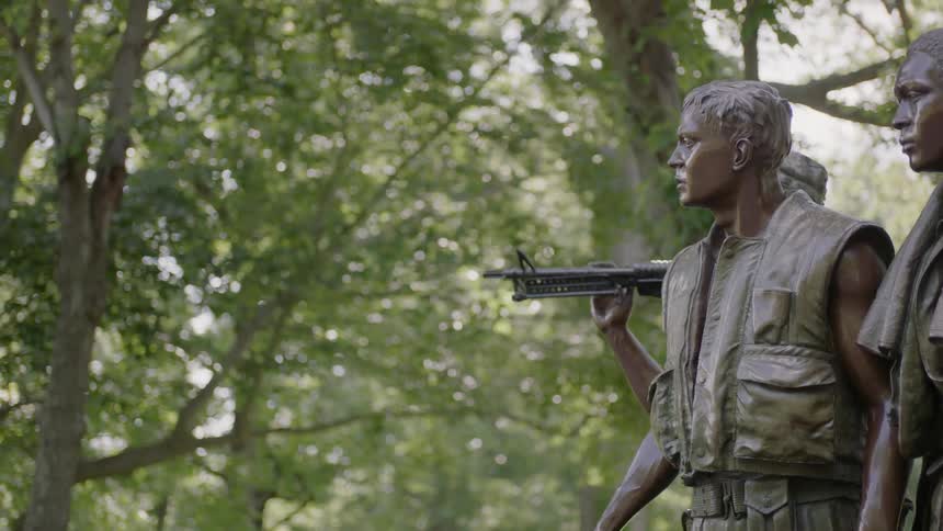 A war statue is displayed outside