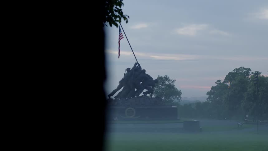 Trees and grass surround the marine corps war memorial