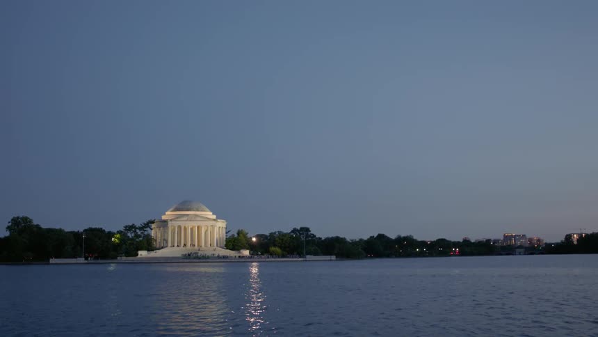 The jefferson memorial is illuminated at night