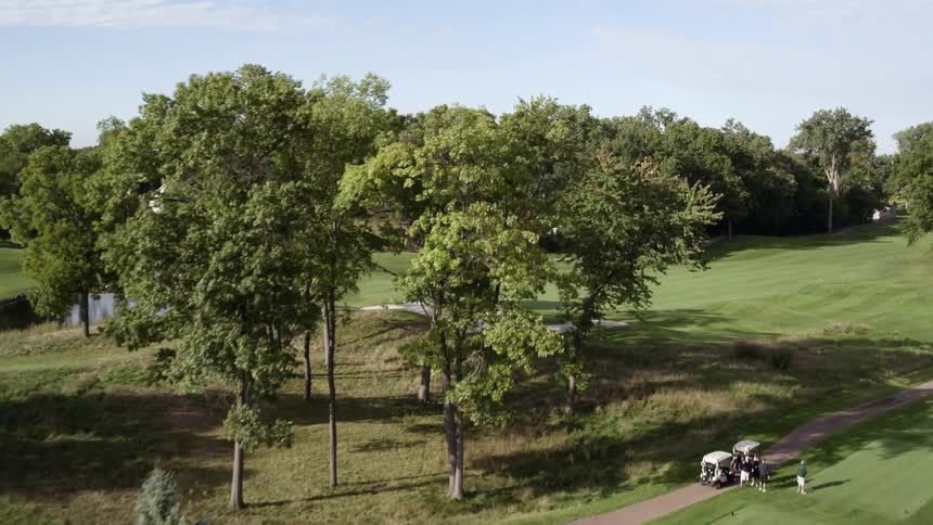 Golfers are playing golf