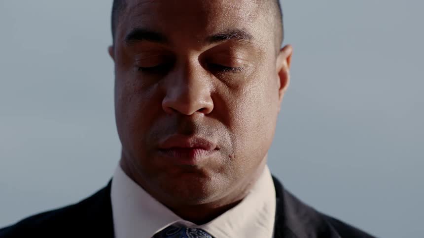 A man grieves at a funeral