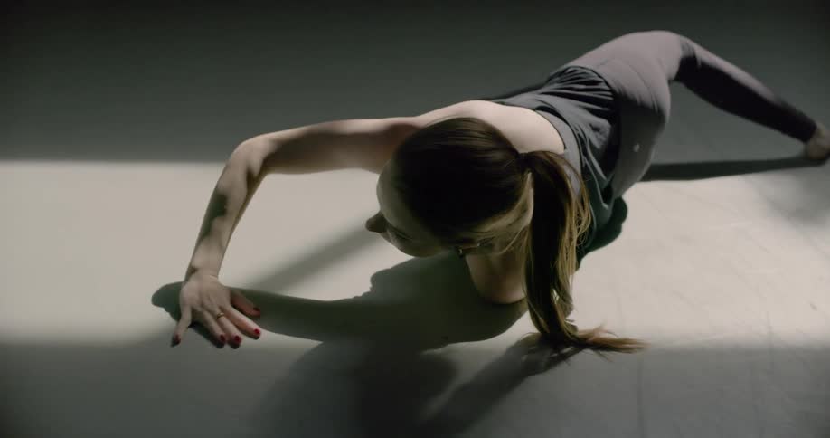 A female dancer practices in a dance studio