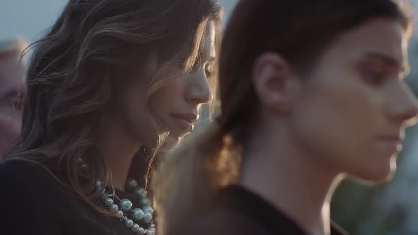 Two women are standing next to each other with sad looks