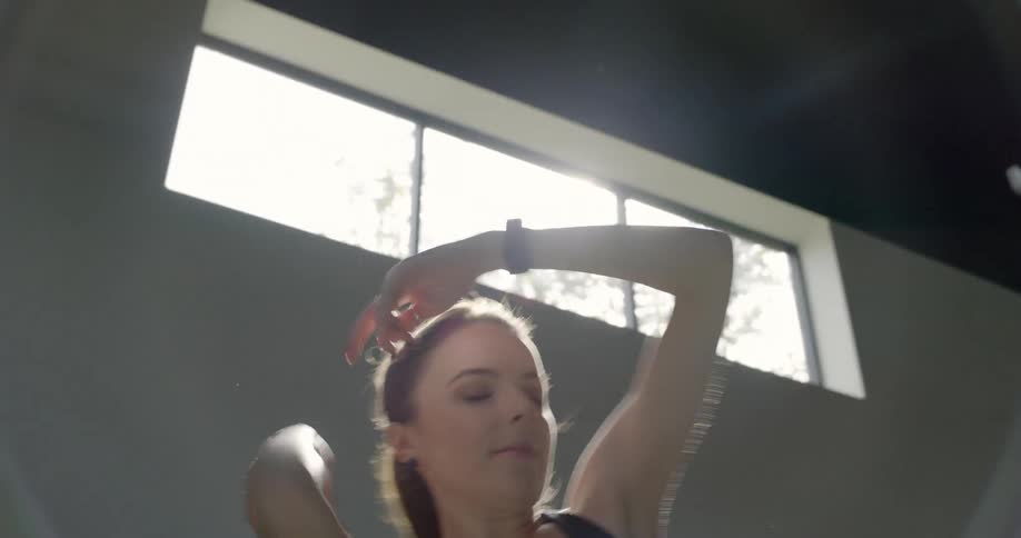 A female dancer practices in a dance studio