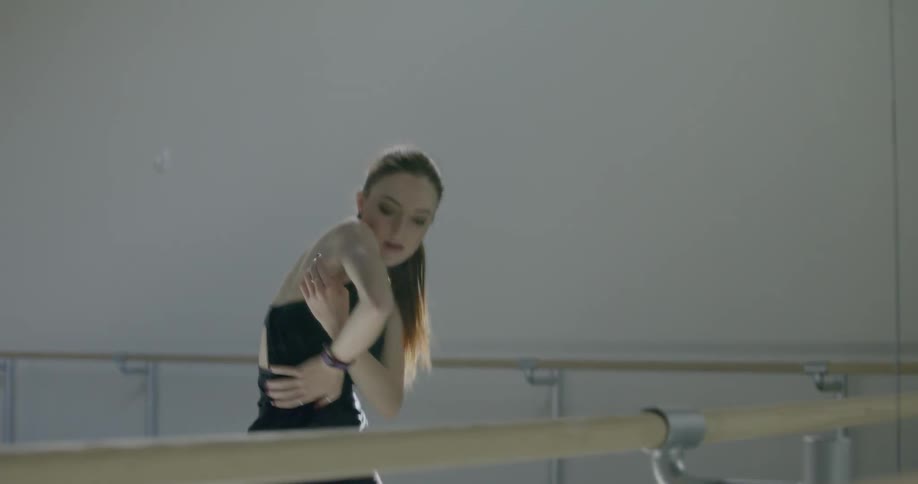 A woman is doing an intense dance routine