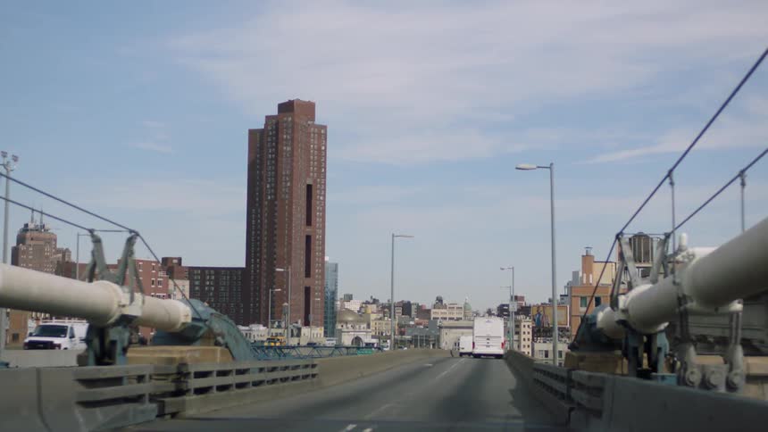 Driving on a bridge in a city