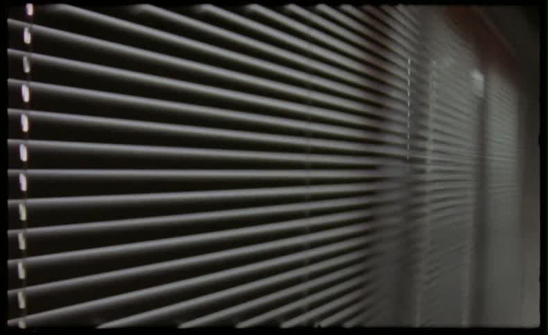 Blinds of a window opening and closing
