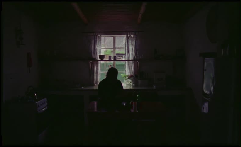 A man sits at a desk