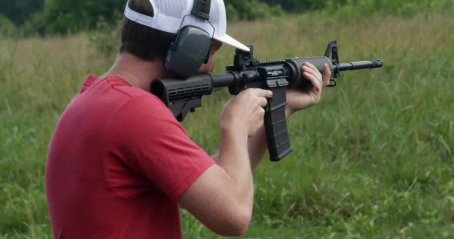 Man practices firing a machine gun