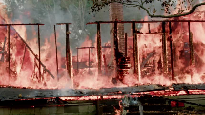 A house fire rages and burns the framing