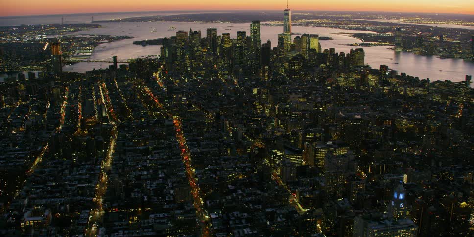 City buildings illuminate the night sky