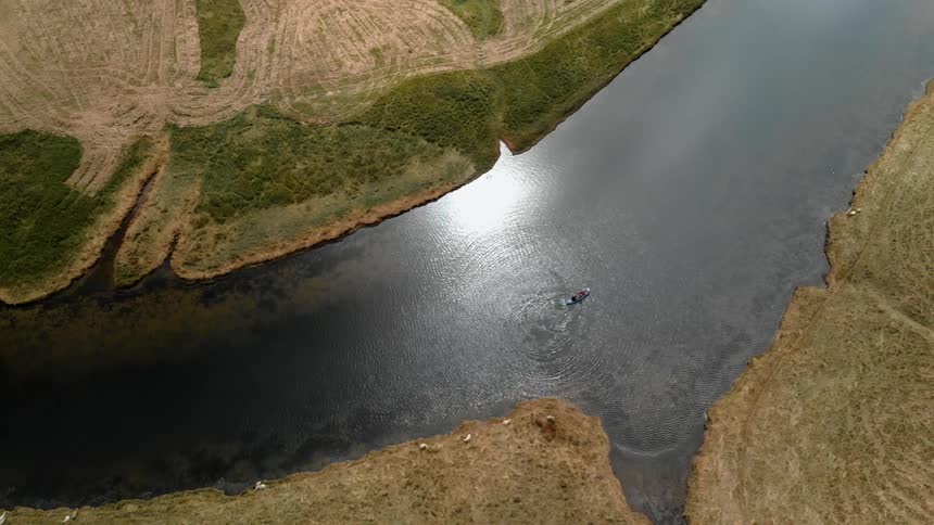 A kayak paddles down a stream