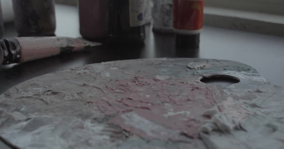 Painting supplies near a window