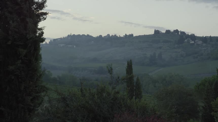 Looking out over the green hillside with a few houses scattered around