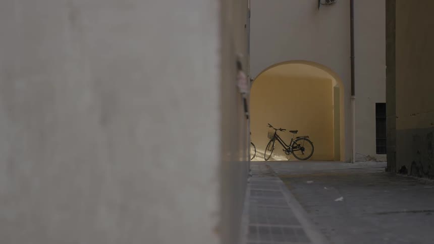 A view of a building slowly moving to the right to expose bicycles