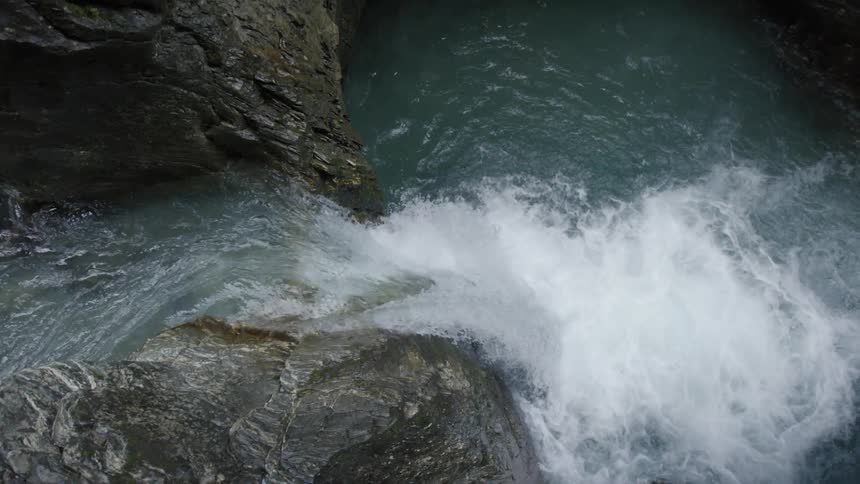 Small waterfall splashing in a river