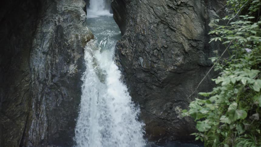 Waterfall splashing down into a river