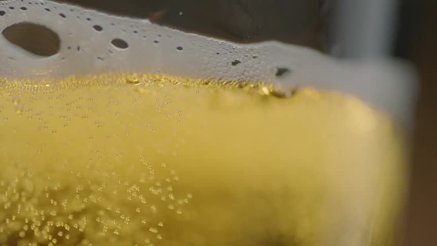 Bubbles rises in a glass of beer