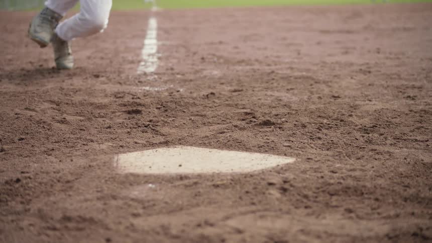 Runner slides into home plate