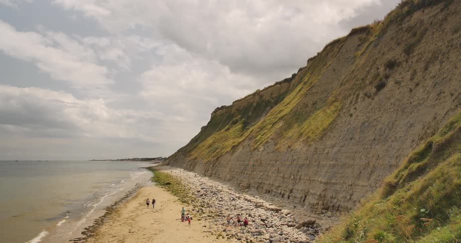 People walk on a beach