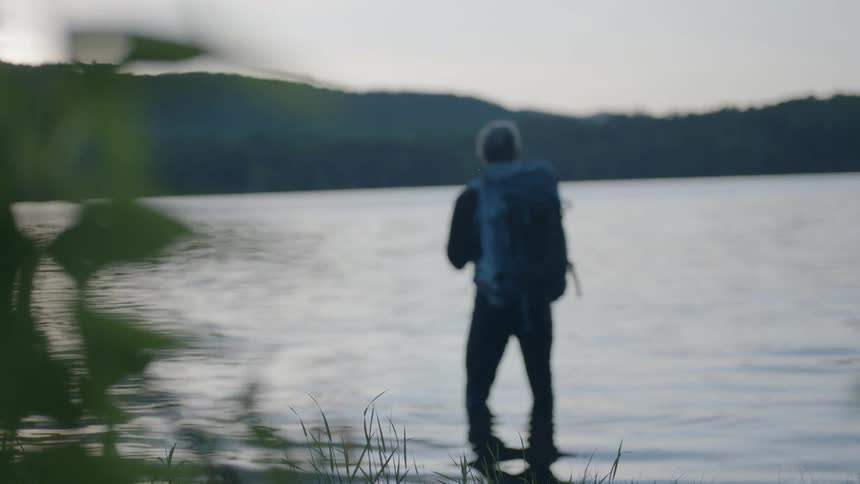 A man stands in a lake