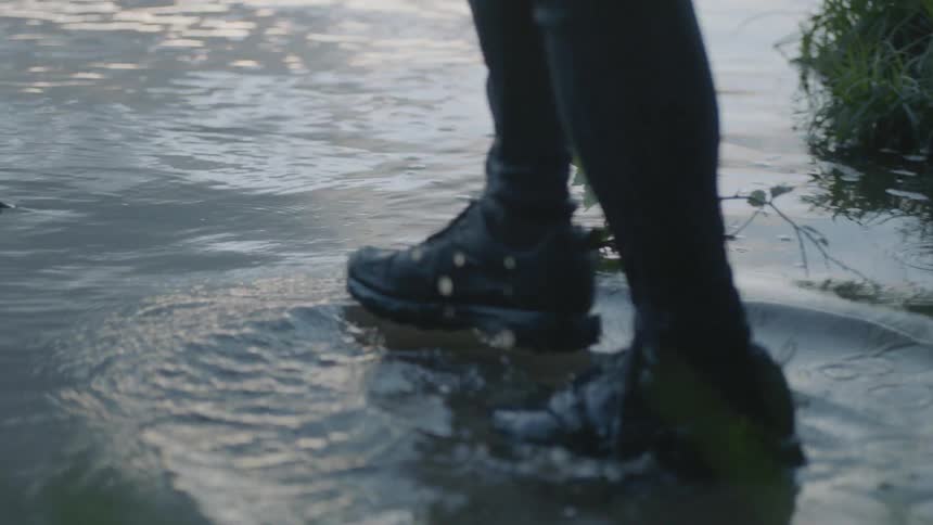 A person walks into the ocean