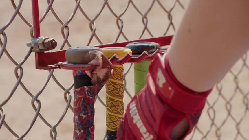 Player returns baseball bat to dugout