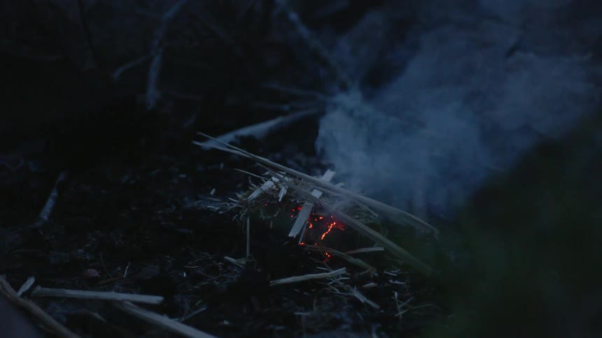 A man starts a fire